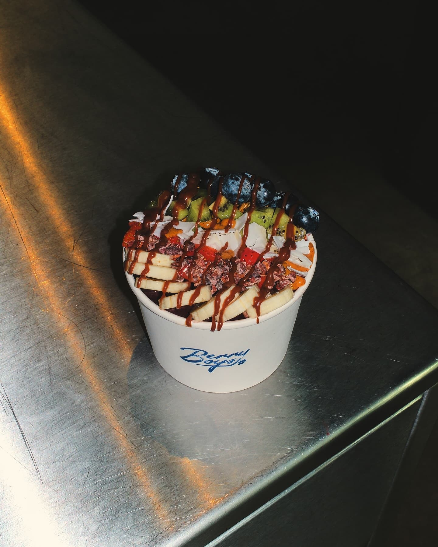 A Berry Boys açaí bowl shot in the brand's editorial style